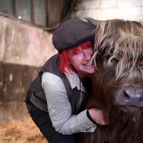 Dumble Farm owner Fiona Wilson is no stranger to cows and is delighted with the success of her 'cuddle a cow' experience which is drawing in new visitors.

