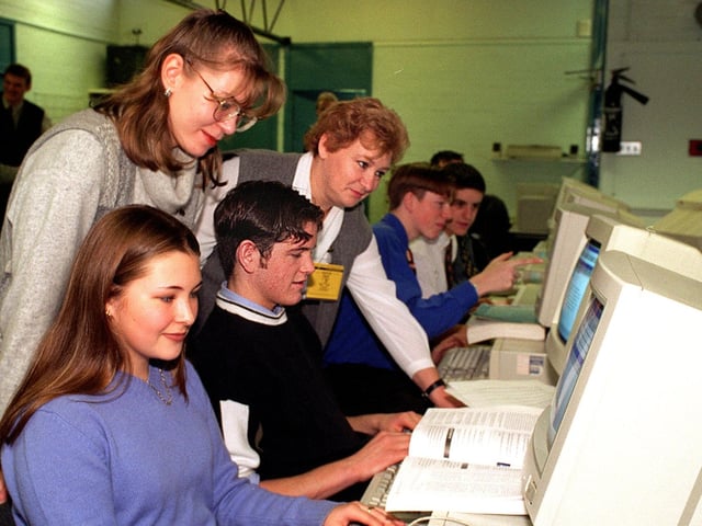 12 Russian teachers visited Garforth Community College in November 1997. Pictured in the economics and business department are Elena Axenova (left) and Maia Katsnelson watching sixth formers Vanessa Yoward and Stephen Hall at work.