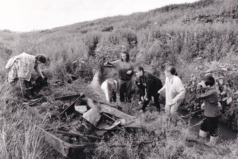 Pupils of East Leeds High School clear rubbish from overgrown Wyke Beck in July 1994.