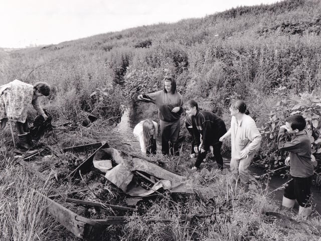 Pupils of East Leeds High School clear rubbish from overgrown Wyke Beck in July 1994.