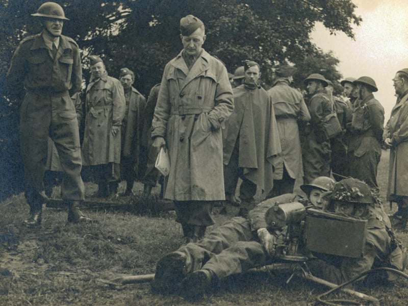 The Machine Gun detachment during inspection. Possibly at Golden Acre as the Leeds Sub-area School of Tactics taught hundreds of officers and senior NCOs in Golden Acre Park (Yorkshire Post & Leeds Intelligencer 1/11/44). In his account of the 9th Battalion written in September 1945, Commanding Officer Lt Col HK Boyle DSO writes about these weekend schools where Tactics, Weapon Training, Bombing, Intelligence, Gas, Street Fighting, Umpiring, Ammunition, Catering, Hygiene and Civil Defence were taught - 'three very full and concentrated week-ends on top of a full time civilian job, though, proved very gruelling to most of those who undertook this'. The soldiers in macs were possibly American Officers.