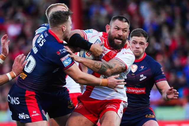 Hull KR's Jared Waerea-Hargreave is tackled by Matty Lees, of St Helens, during last weekend's Super League semi-final. Picture by Olly Hassell/SWpix.com.