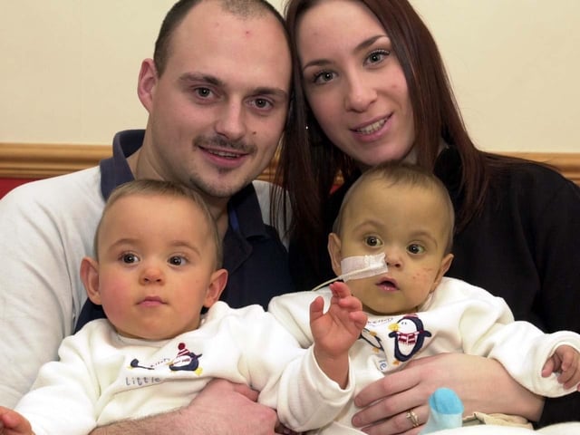Bramley parents James and Estelle Barrett are pictured  with their premature twins Kalum and Jacob who were celebrating their first Christmas in December 2003.