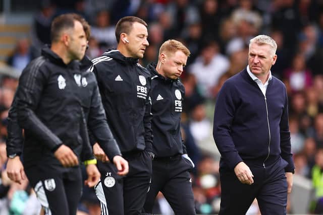HAMMER BLOW: For Leicester City under boss Dean Smith, right, and assistant John Terry, second left, pictured heading for half-time 3-0 down at Fulham. 
Photo by Clive Rose/Getty Images.
