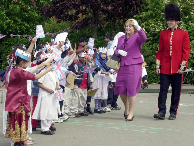Greenmount Primary School held at golden jubilee party in May 2002. Pictured is teacher Lori Graham-Dixon who played the queen and  learning mentor Joe Taheri as a guard with some of the pupils.