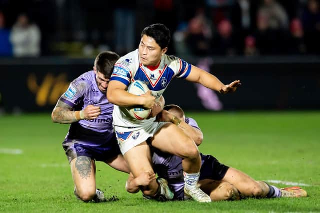 Mason Lino is tackled by Oliver Gildart and James Batchelor during Wakefield Trinity's narrow home loss to Hull KR in Super League round two. Picture by Allan McKenzie/SWpix.com.