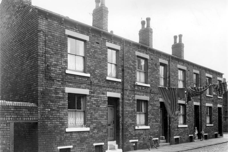 Odd numbered back-to-backs on Stapleton Street in June 1961. Access to outside toilets can be seen on the left edge. These houses were included in slum clearance plans for the Holdforth Street area.
