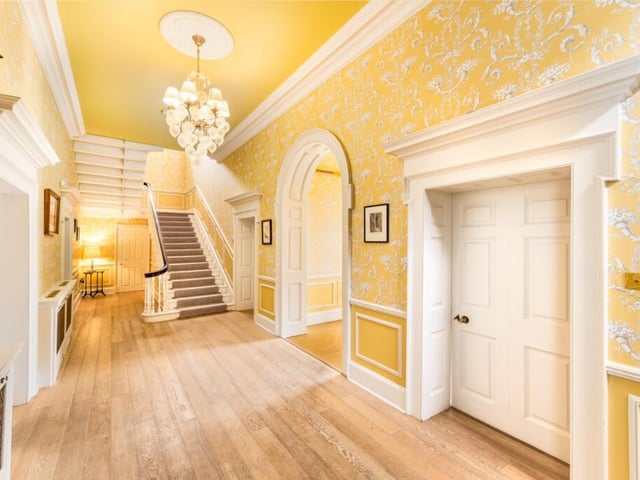 A grand sweeping double staircase greets you immediately capturing the grandeur of the home.