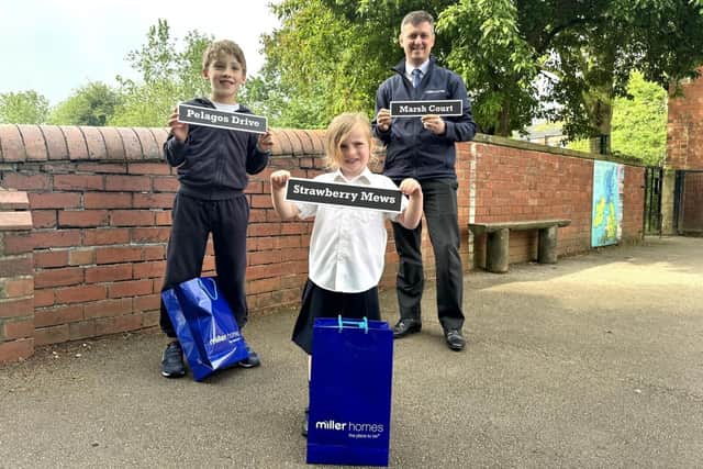 Street naming winners, Emily and Joel pictured with Miller Homes Yorkshire marketing manager, Chris