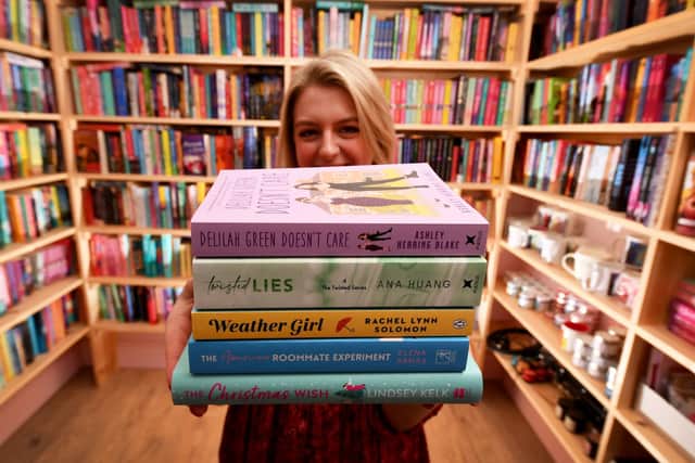 Amy Richard with some of her romantic fiction books in The Smut Hut. Picture: Simon Hulme