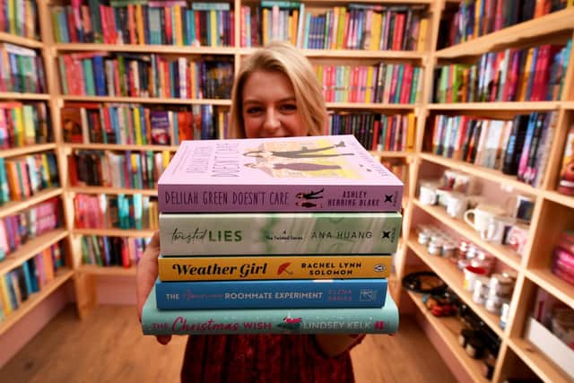 Amy Richard with some of her romantic fiction books in The Smut Hut. Picture: Simon Hulme