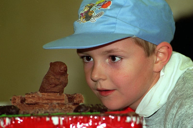 Brett Barnsdale of the 6th Beeston Beavers has a close look at the cake made to celebrate the 10th birthday of Beaver Scouts in May 1996.