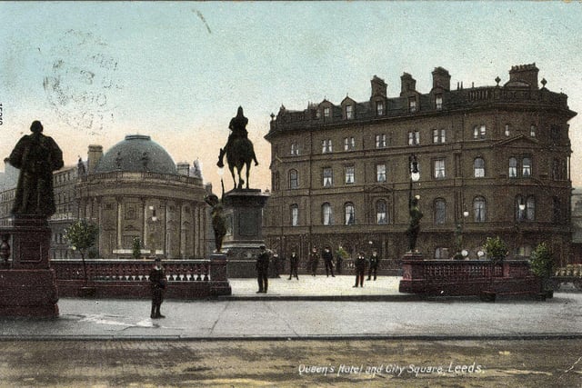 A colour-tinted postcard of City Square with a postmark August 8, 1906. The statues of John Harrison (left) and the Black Prince (centre) can be seen, along with two of Alfred Drury's 'Morn' and 'Even' figure lamps. In the background are the London City and Midland Bank (left), later just the Midland Bank, and the original Queen's Hotel (right), dating back to 1863.