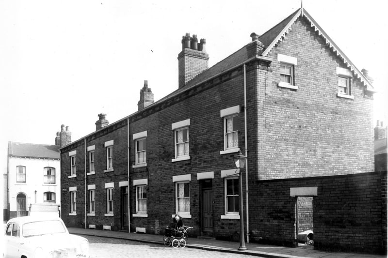 The remaining portion of Pease Street pictured in May 1959. the rest had been previously demolished. The white painted property was part of Palmers Tyre Company.