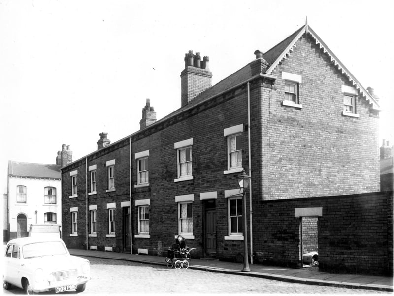 The remaining portion of Pease Street pictured in May 1959. the rest had been previously demolished. The white painted property was part of Palmers Tyre Company.