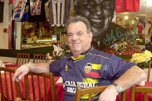Vincente Rodriguez, owner of La Comida, who combined running his restaurant with commentating on his favourite football team Valencia, for Spanish TV. He is pictured in May 2000.