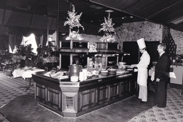 Trainee chef Andrew Lenaghan serving up at the Rosewood Table in September 1983.