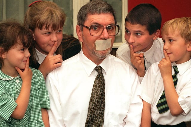 A sponsored silence at All Saints C of E Primary in Richmond Hill raised  £1,800 for local charities in June 1996. Pictured is headteacher Denis Penman pictured with some of the pupils who took part. They are, from left, Natalie Watson, Donna Deighton, Charley Cook and Christopher Proctor.