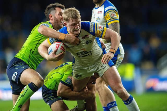 Leeds Rhinos' James McDonnell is tackled during the defeat by Warrington Wolves. Picture by Bruce Rollinson.