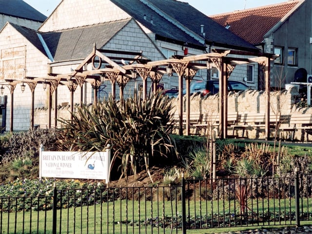 Wetherby's Bridge Foot garden with pergola and seating. It was entered in the 'Britain in Bloom' competition and was national winner in 1998. In 1999 the garden won a European Gold Award. This is behind the market place opposite Wetherby Bridge.