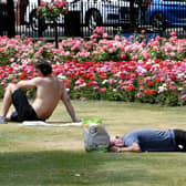 People enjoy the sunshine in Park Square, Leeds, as the country sweltered in the heatwave on July 19.