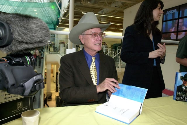 Actor Larry Hagman, who played John Ross 'J.R.' Ewing, from the TV show Dallas, visits Asda in Pudsey to launch his new book Hello Darlin, in 2001.