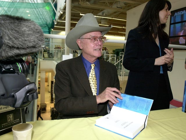 Actor Larry Hagman, who played John Ross 'J.R.' Ewing, from the TV show Dallas, visits Asda in Pudsey to launch his new book Hello Darlin, in 2001.