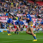 Muizz Mustapha, on the right of the picture, warms up with Rhinos ahead of the Grand Final. Picture by Bruce Rollinson.