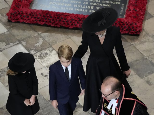 The Princess of Wales, Prince George (centre), and Princess Charlotte (left) arrive