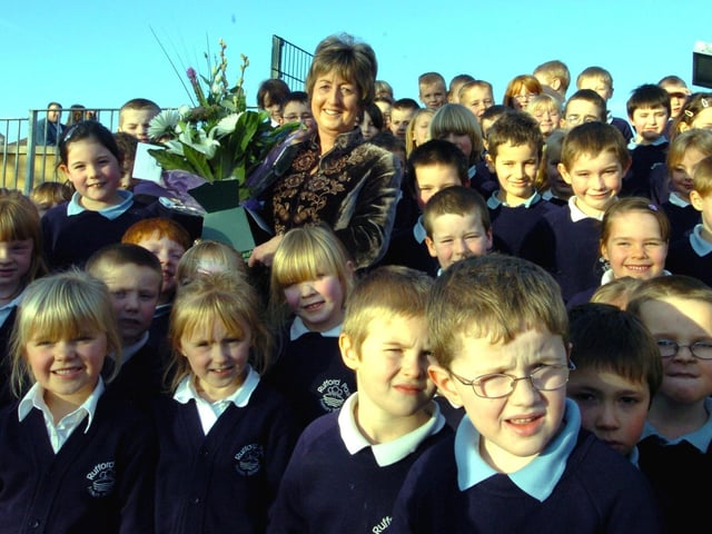 Former headteacher Frances Lambley opened the new Rufford Park Primary School at Yeadon in January 2006. She is pictured with some of the pupils after the opening ceremony.