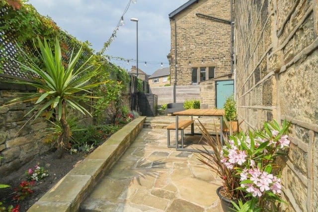 Outside, the garden has a generous stone patio area which enjoys a south facing aspect and is the perfect entertaining and relaxing space.