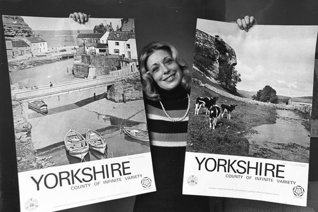 Jane Wylde, commercial developments manager of the Yorkshire Tourist Board in York proudly displays two picturesque posters publicising tourism in February 1973.
