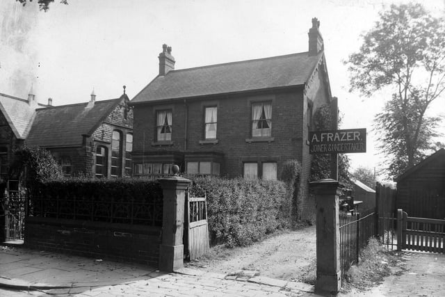Shadwell Lane showing, in the centre, no. 4, Alan Frazer, joiner and undertaker. To the left part of Moortown Council School (now Moortown Primary School) can be seen. Pictured in August 1939.