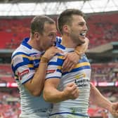 Danny McGuire, left, congratulates Tom Briscoe on his fourth try for Rhinos against Hull KR at Wembley in 2015. They will be rivals this weekend. Picture by Allan McKenzie/SWpix.com.
