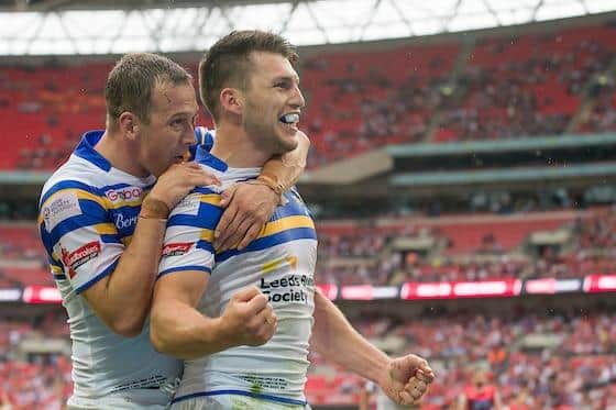Danny McGuire, left, congratulates Tom Briscoe on his fourth try for Rhinos against Hull KR at Wembley in 2015. They will be rivals this weekend. Picture by Allan McKenzie/SWpix.com.