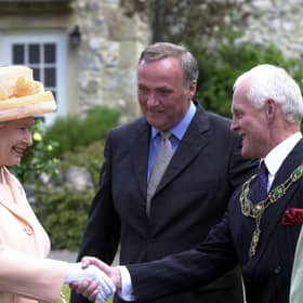 Visiting the set of Emmerdale in 2002. The Queen and Duke of Edinburgh's visit to Harewood House and the Emmerdale set. The Queen meets Emmerdale actor Chris Chittell, right, and Emmerdale Line Producer Tim Fee.