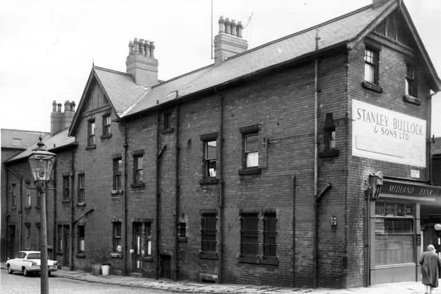 View of terrace housing in Brookdale Place. Far right is Beeston Road (Beeston Hill). The address of the Midland Bank seen is 70 Beeston Hill. Above the bank is a sign for Stanley Bullock & Sons Ltd. This was a firm of builders and contractors and also Funeral Directors on Beeston Hill.