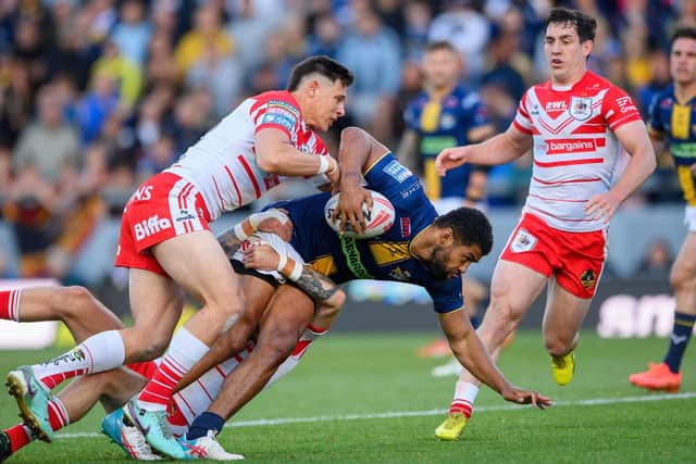 Kallum Watkins is tackled by Shane Wright during Leeds Rhinos' home win against St Helens in June. Picture by Allan McKenzie/SWpix.com.