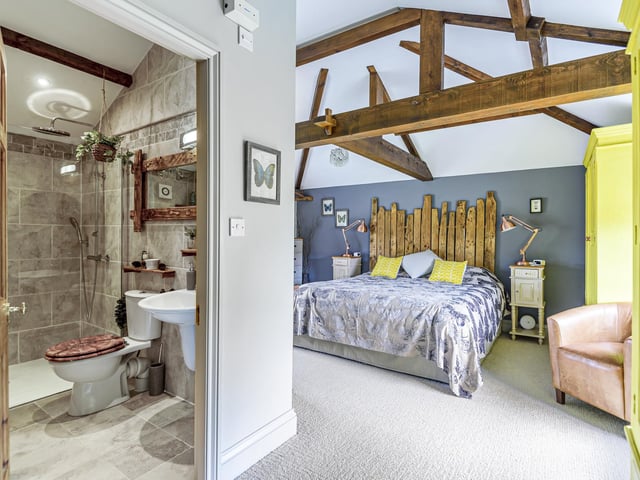 Beamed bedrooms are individually styled.