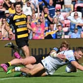 Ash Handley scores one of Leeds Rhinos' 12 tries in the 66-16 win at York Knights which moved them back into top spot in Betfred Super League. Picture by Matthew Merrick/SWpix.com.