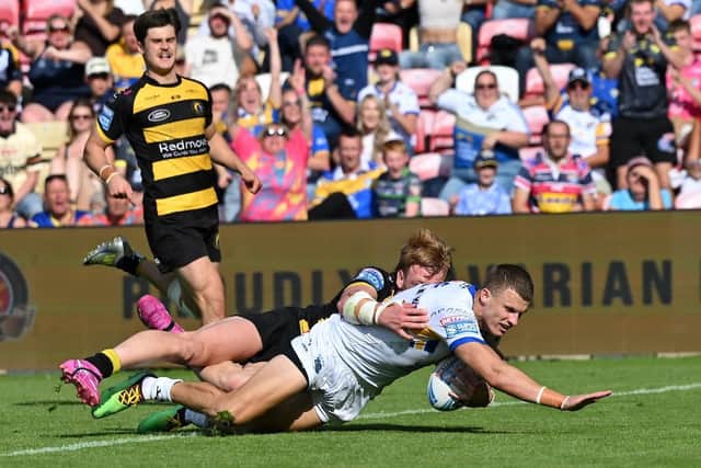 Ash Handley scores one of Leeds Rhinos' 12 tries in the 66-16 win at York Knights which moved them back into top spot in Betfred Super League. Picture by Matthew Merrick/SWpix.com.