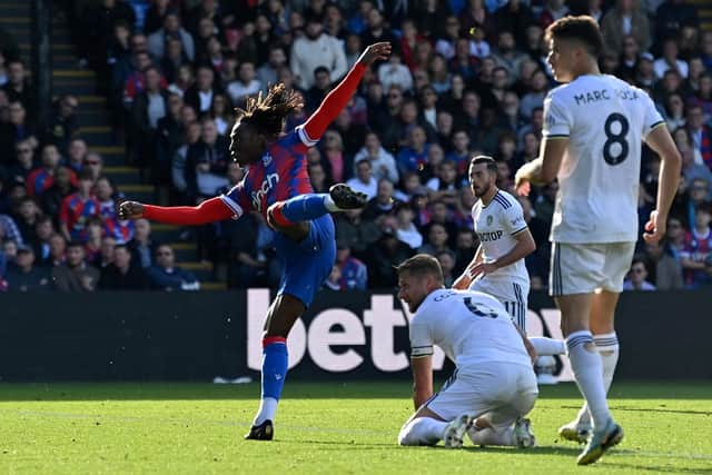WINNER: Eberechi Eze wheels away to celebrate after firing Crystal Palace in front against Leeds United as Whites captain Liam Cooper looks on.
Photo by GLYN KIRK/AFP via Getty Images.