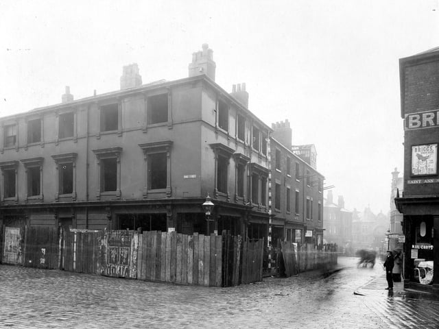 A view of derelict buildings on corner of Wade Street with Woodhouse Lane. St Ann Street is on the right. Pictured in August 1906.