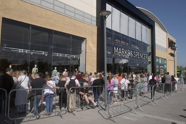Shoppers queued to get inside ahead of the official unveiling at 10am