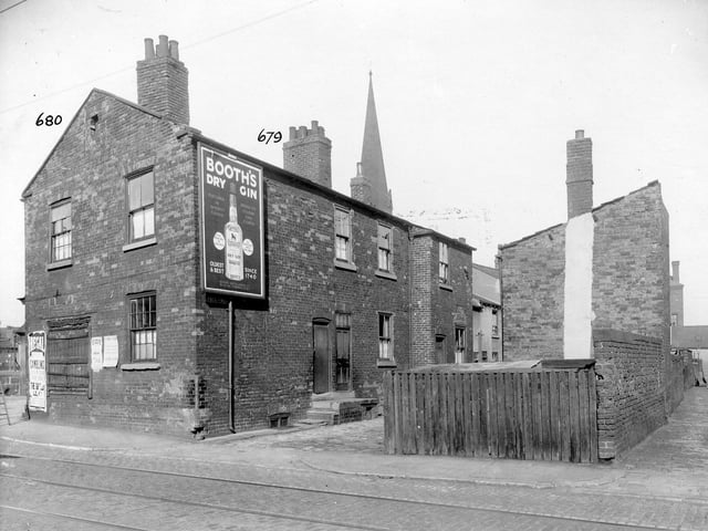 The Balm Road area, showing tram-lines in September 1935. Tate Court with advertisement for Booth's Dry Gin on end of house. A church steeple can be seen in the background.