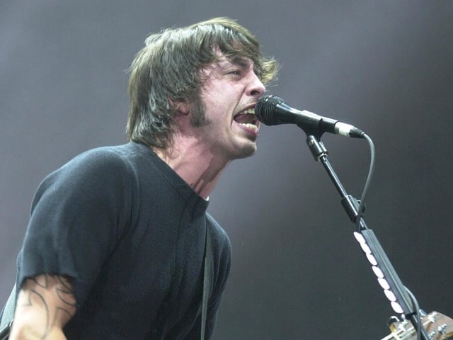 Dave Grohl of the Foo Fighters on stage in 2002. The band have won 15 Grammy Awards, including Best Rock Album five times, making them among the most successful rock acts in Grammy history. They were inducted into the Rock and Roll Hall of Fame in 2021, their first year of eligibility.