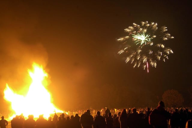 People gather round the bonfire to watch the firework display at Middleton Park in November 2003.