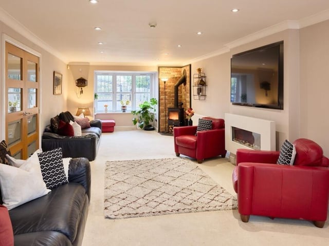 The vast, dual-aspect lounge runs the full length of the house and is flooded with natural light from the large bay window at the front and the second set of French doors at the rear.