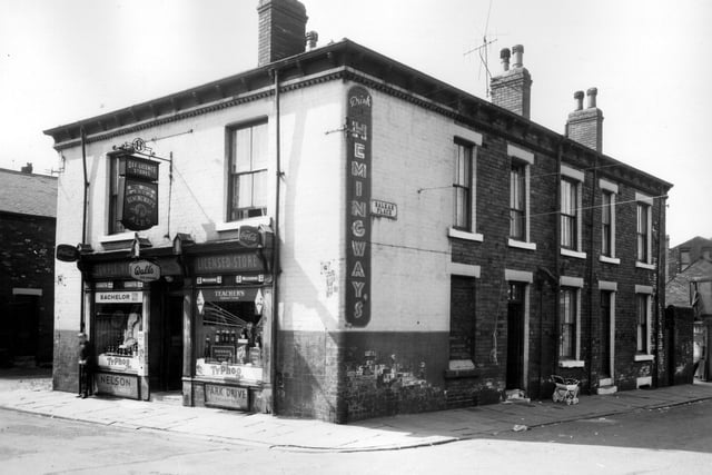 Temple View licensed store on Temple View Road advertising Hemingway's Ales, Coca-Cola, Wall's ice-cream,Typhoo tea, Whiteways Wine and a variety of cigarettes. Pictured in July 1963.