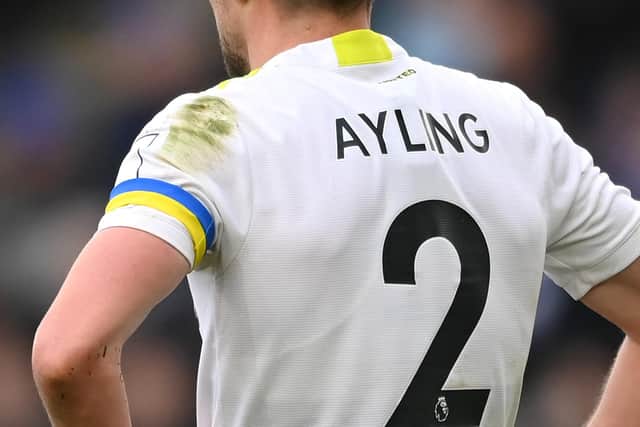 LEICESTER, ENGLAND - MARCH 05: Luke Ayling of Leeds United wears a Ukraine captains armband to indicate peace and sympathy with Ukraine during the Premier League match between Leicester City and Leeds United at The King Power Stadium on March 05, 2022 in Leicester, England. (Photo by Michael Regan/Getty Images)